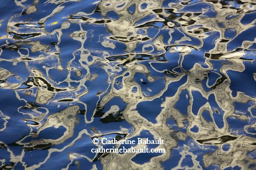 white and black reflections in blue waters, Vancouver Island, British Columbia, Canada, rights-managed, stock images, © Catherine Babault